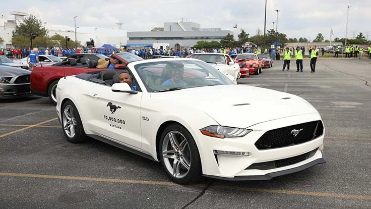 Ford workers celebrate production of the 10 millionth Mustang in 2018.