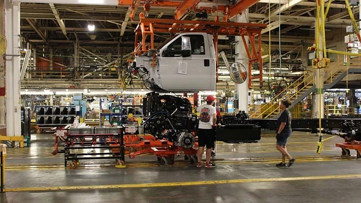 Workers assemble a medium-duty truck at Ford's Ohio Assembly Plant near Cleveland. The facility will get a $900 investment for new products if workers agree to a new deal between the automaker and the United Auto Workers.