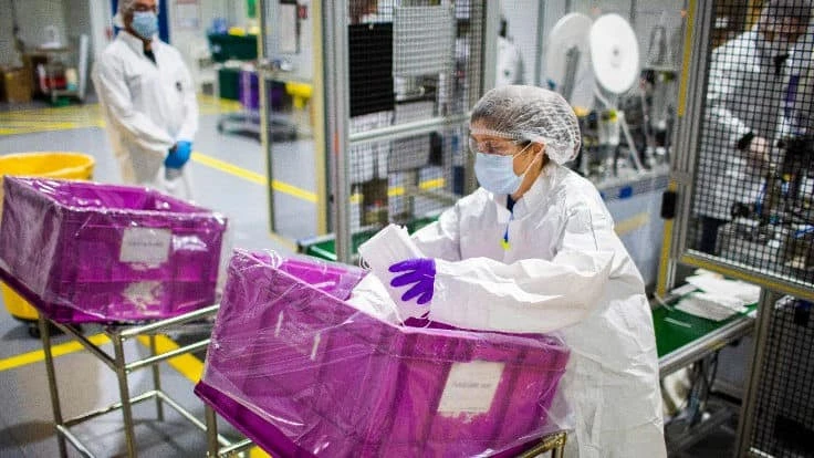 Workers at Ford's Van Dyke Transmission Plant near Detroit make face masks for medical workers and, eventually, for Ford's workforce. 