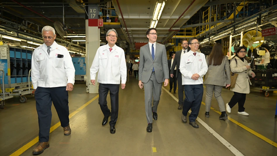 The Right Honourable Justin Trudeau, prime minister of Canada (center) walks with Toshihiro Mibe, president and CEO of Honda Motor Co. (second from left)., at Honda of Canada Mfg., where the company announced a $15-billion investment to build a comprehensive electric vehicle value chain in Canada.