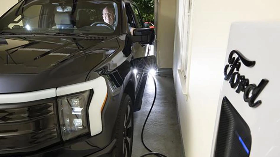 Brian Foreman sits in the driver’s seat of his Ford F-150 Lightning truck in the garage of his home in Howard County, Maryland. Foreman was the first person in the country to power his home with energy from his electric vehicle’s battery while the grid was operating normally as part of Sunrun and BGE’s vehicle-to-home power plant initiative.