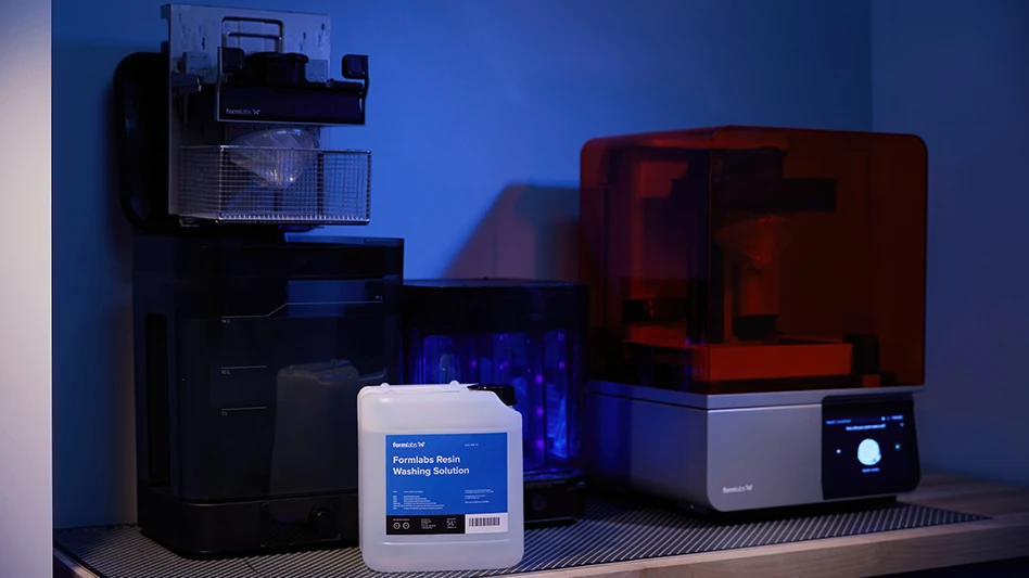 A 3D printer with a bottle of washing solution