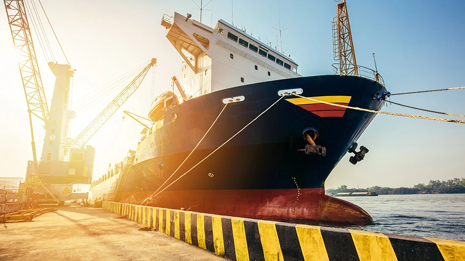 A large cargo ship at a dock