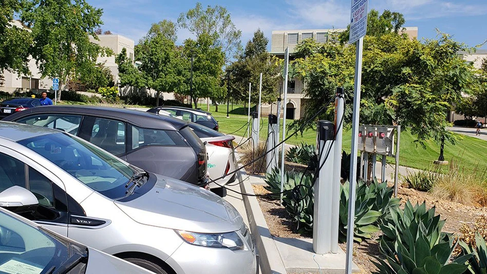 Electric vehicles plugged into charging stations