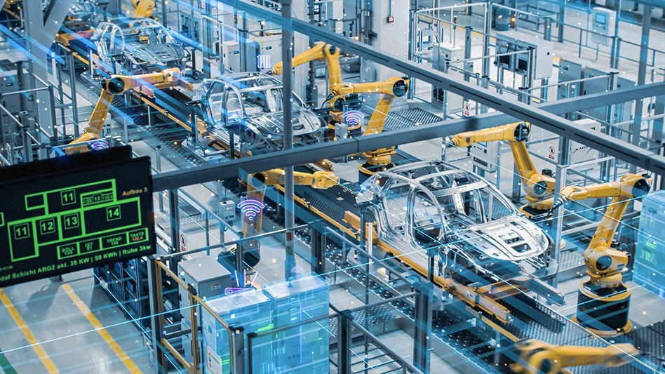 Robotic arms work on cars in a factory