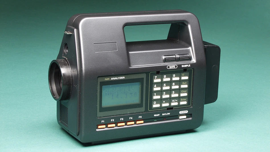 A piece of monitoring equipment on a green background