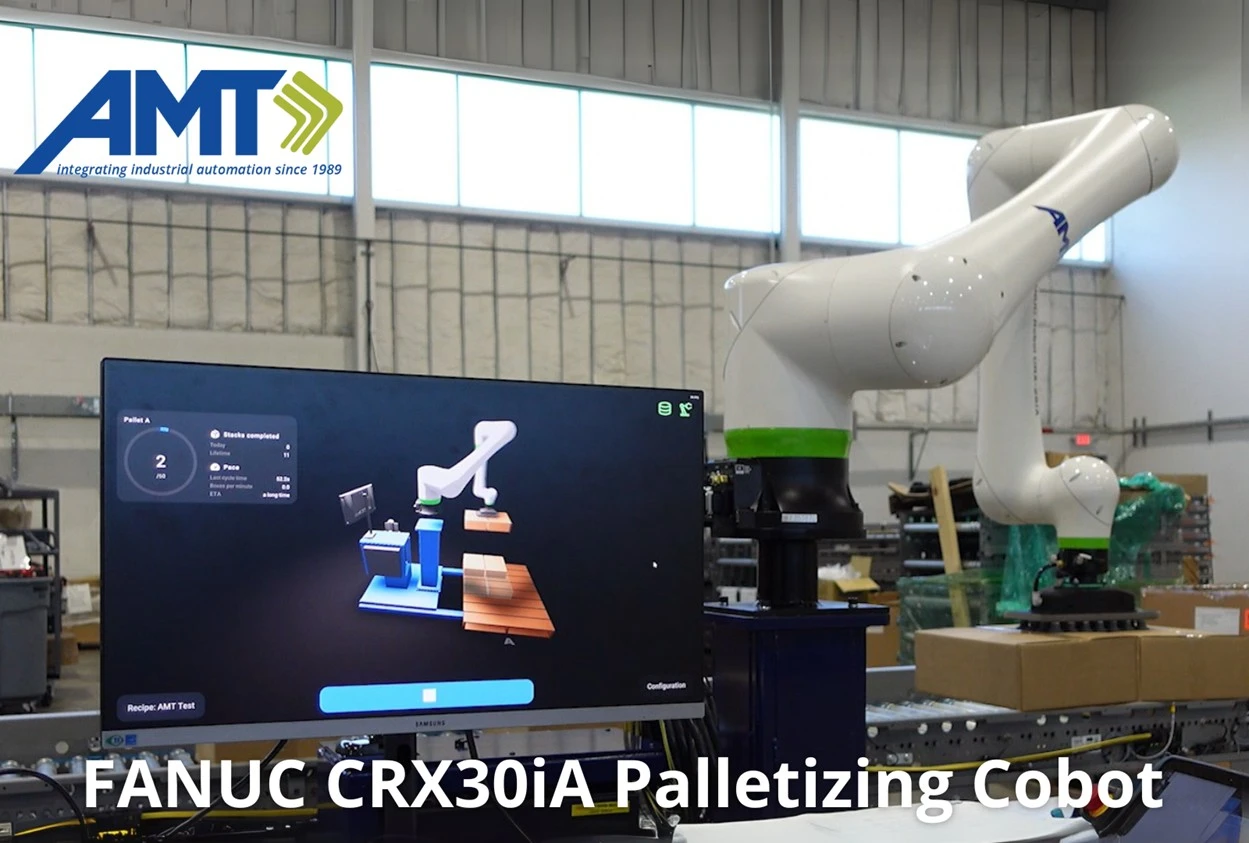 A screen shows a virtual rendering of the robot arm behind it