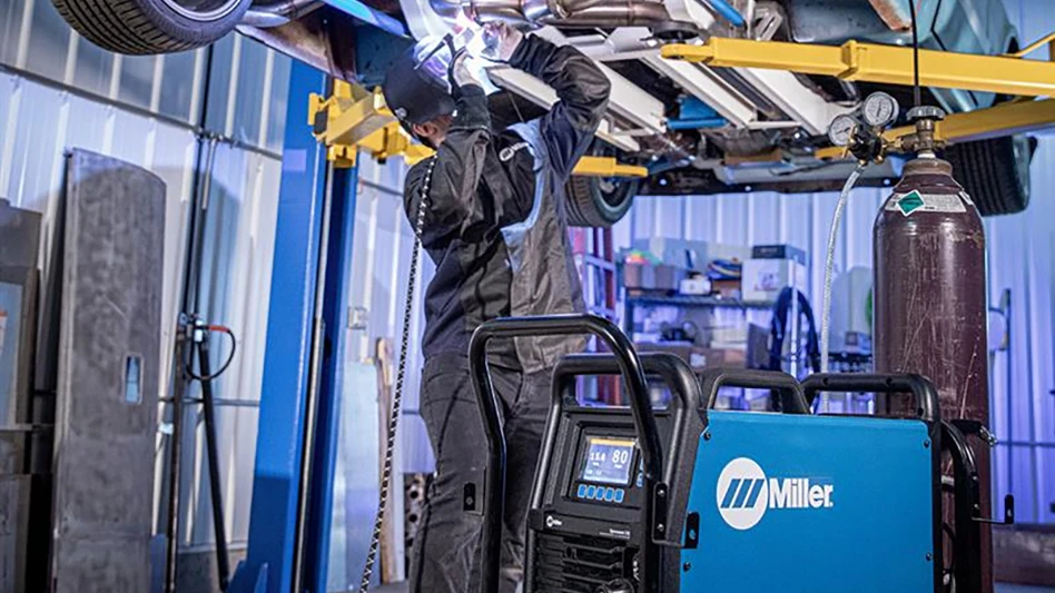 A person welding in a factory