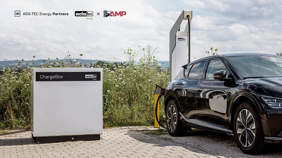 A black car parked next to a charger