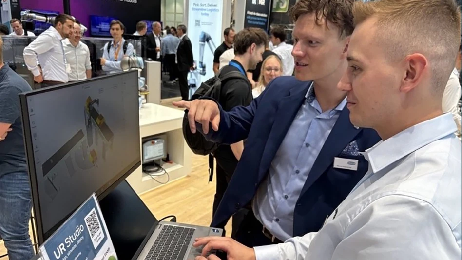 Two people looking at a computer screen