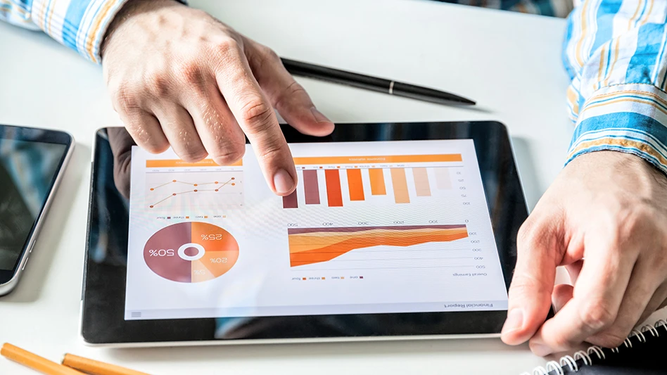 A person working with graphs on a tablet