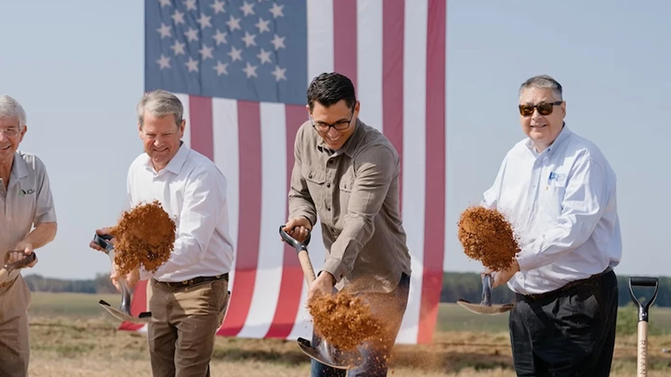 People with shovels at a construction site