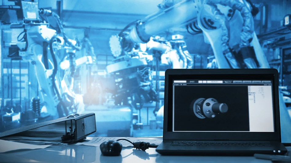 A computer displaying a rendering of an auto part in front of robotic arms